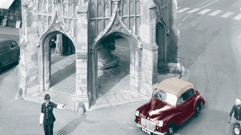 Image of a Morris Minor driving through Chichester
